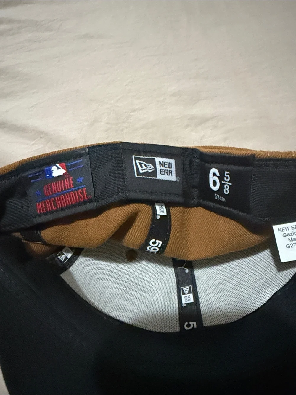 Brown and Black Baseball Cap with Yellow-Outlined 'P' Patch